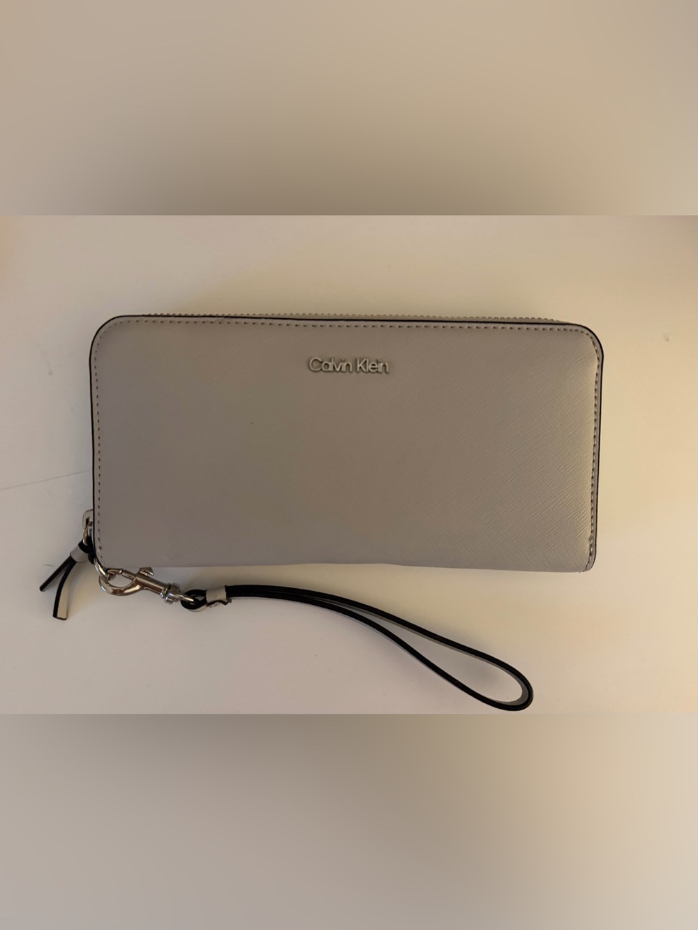 Calvin Klein Pale Gray Leather Wristlet with Black Strap
